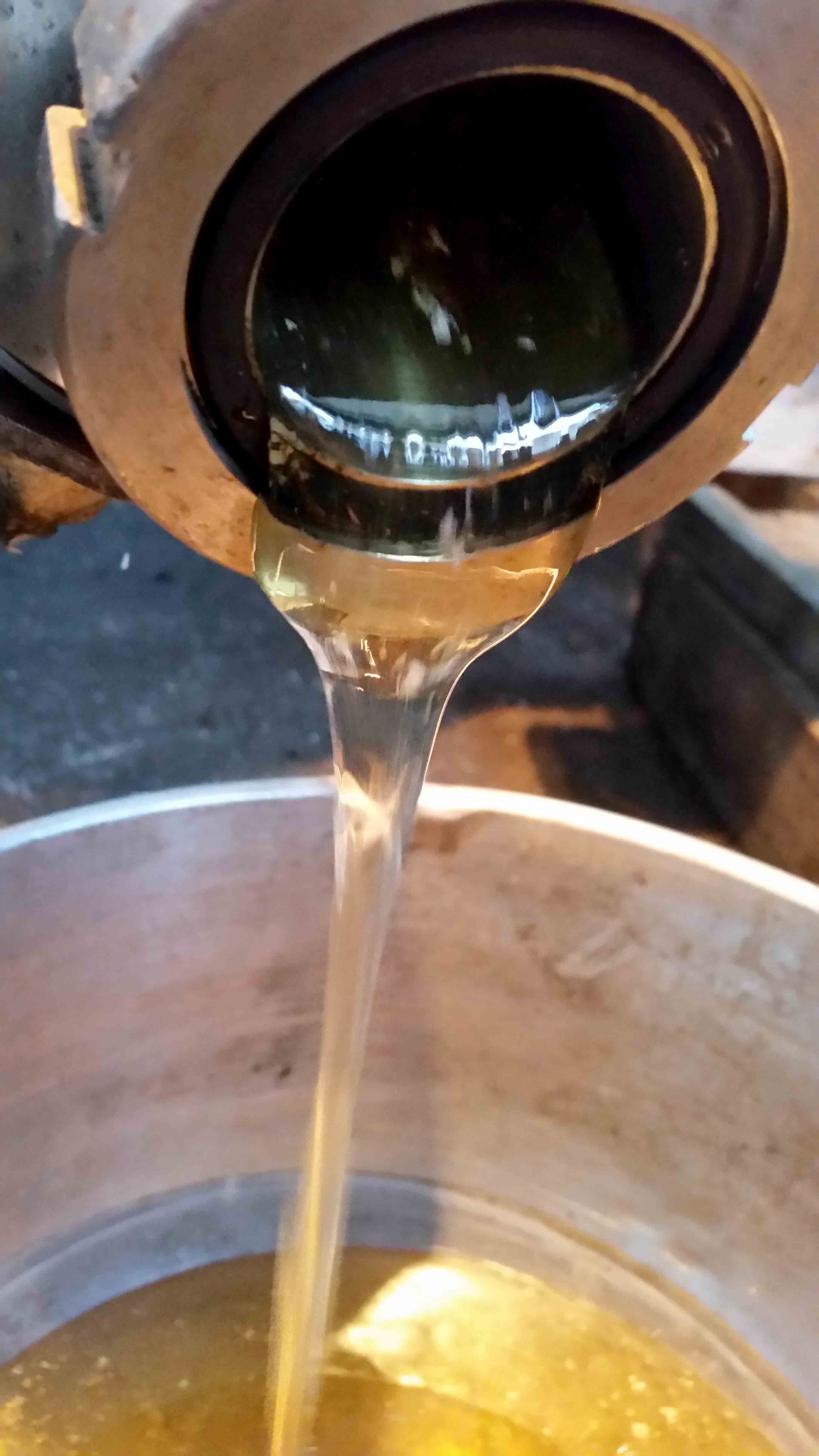 Honey Being Poured From An Extractor - Greenside Up